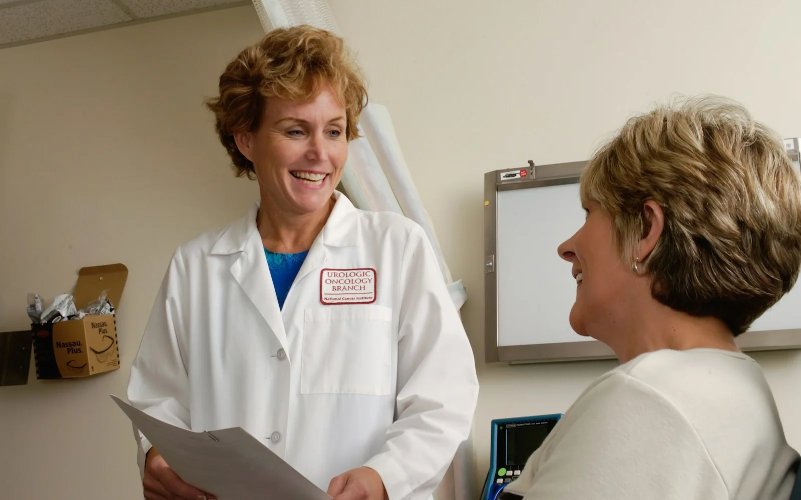 Doctor talking with a patient, representing medical practice website design