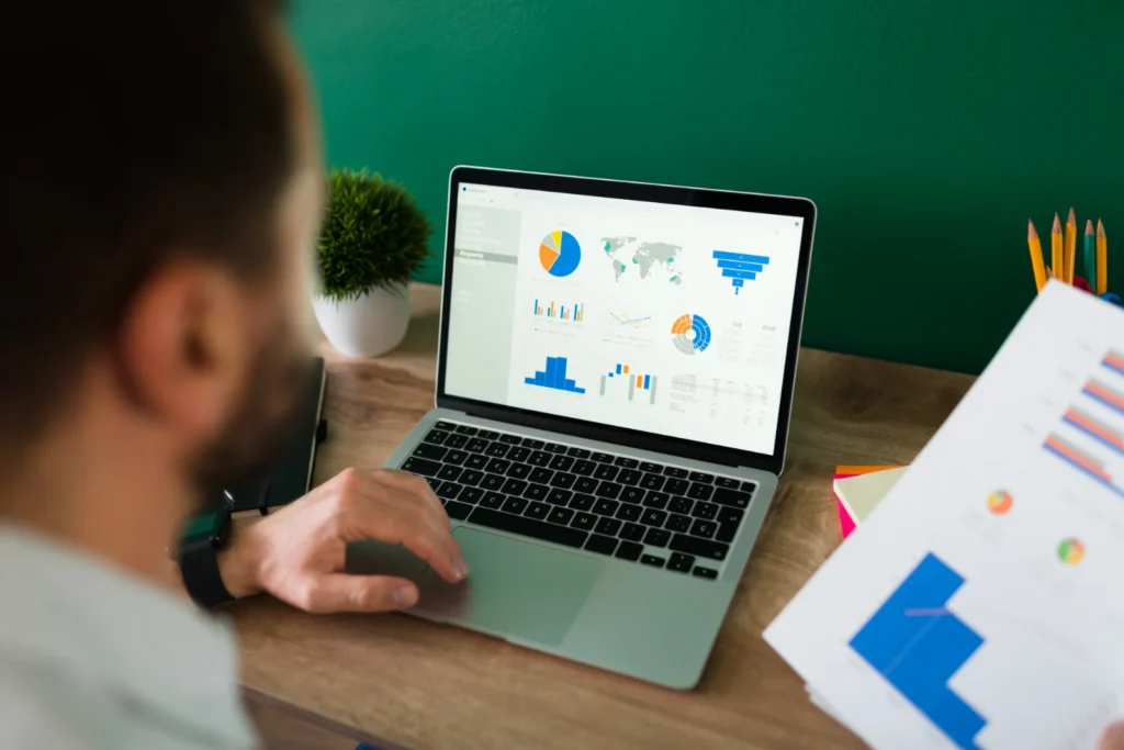 Business owner checking on-page SEO results on a laptop