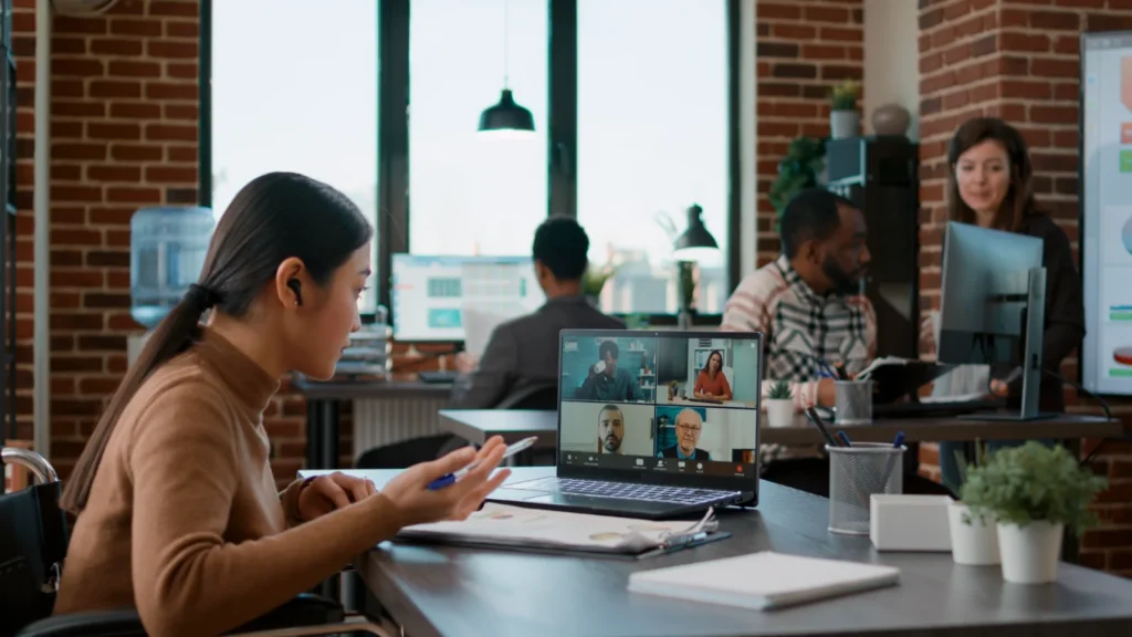 Remote web development team meeting a client on a video call