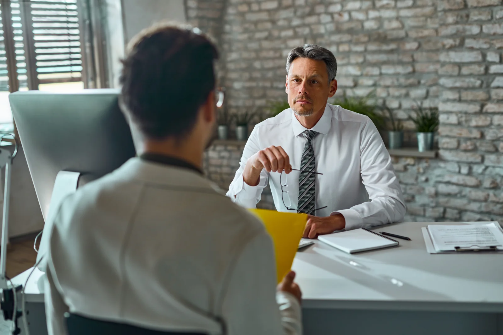 HR recruiter interviewing a candidate for a small business