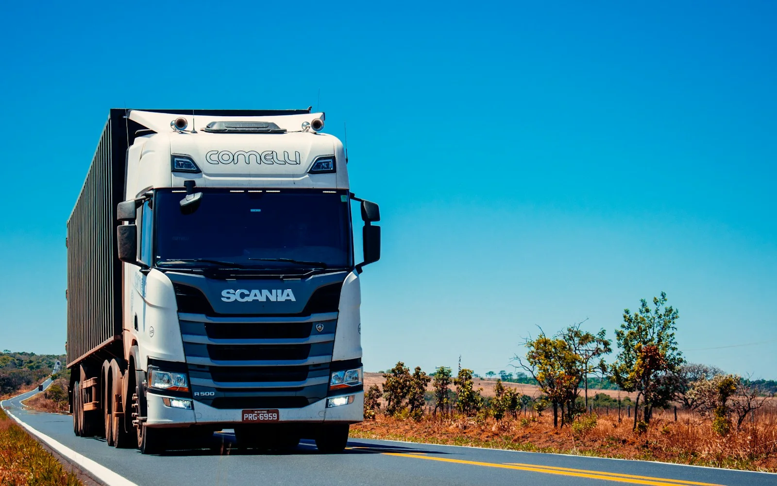 White semi truck on the highway for a trucking company website
